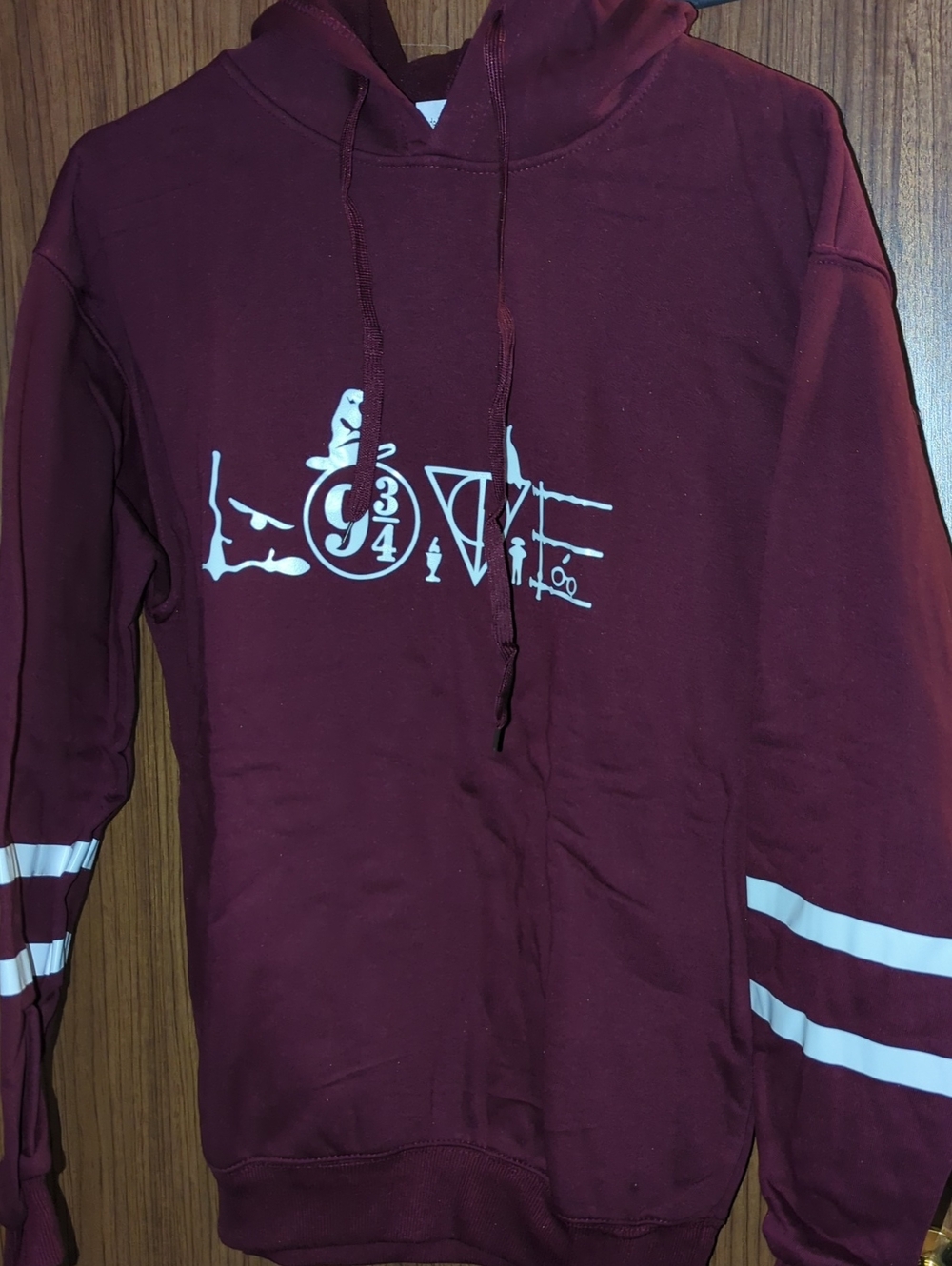 Maroon Graphic Hoodie with White Stripes Harry Potter Medium Size .